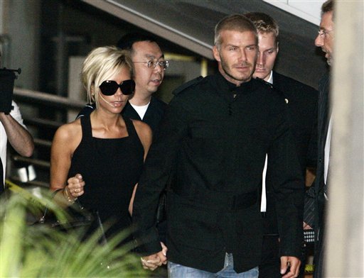 England soccer player David Beckham arrives at Los Angeles International Airport with his wife Victoria in Los Angeles. Beckham has signed to play for the Major League Soccer team Los Angeles Galaxy. Beckhams arrive in LA