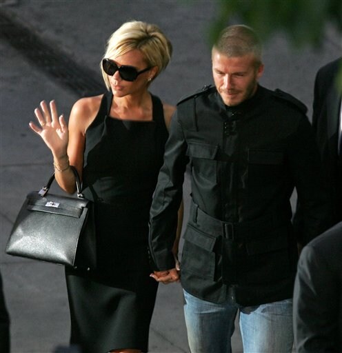 Beckham with wife Victoria as he arrives at Los Angeles International Airport. Beckhams arrive in LA