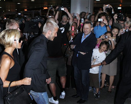 Beckham and wife Victoria arrive at Los Angeles International Airport while Angelinos look. Beckhams arrive in LA