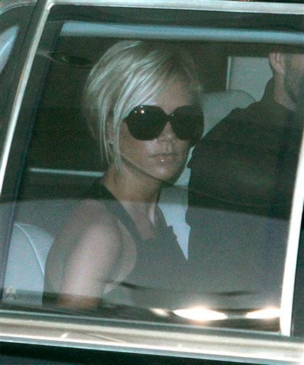 Victoria Beckham looks out the window from her car after arriving at Los Angeles International Airport. Beckhams arrive in LA