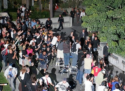Members of the media record the arrival of Beckham with wife Victoria. Beckhams arrive in LA