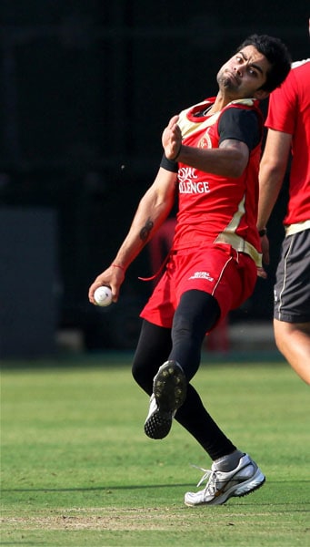Virat Kohli bowls during a practice session ahead of Royal Challengers match against Chennai Super Kings at Chinnaswami Stadium in Bangalore on Monday. (PTI Image) Royal Challengers' net session