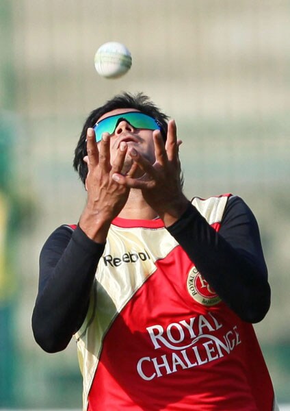 Royal Challengers Bangalore cricketer Manish Pandey takes a catch during a practice session ahead of their match against Chennai Super Kings at Chinnaswami Stadium in Bangalore on Monday.(PTI Image) Royal Challengers' net session