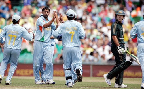 Praveen Kumar, second left, is congratulated by teammates after bowling out Australia's captain Ricky Ponting, right, for 4 runs during the first final of their tri-nations one-day international series at the Sydney Cricket Ground on Sunday, March 2, 2008. First final - India vs Australia