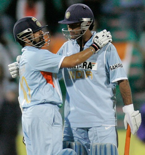 Harbhajan Singh, right, embraces teammate Sachin Tendulkar after Tendulkar lead his team to a victory over Australia in the first final of their tri-nations one-day international series at the Sydney Cricket Ground on Sunday, March 2, 2008. India won with 25 balls remaining after Australia made 239 in their innings. First final - India vs Australia