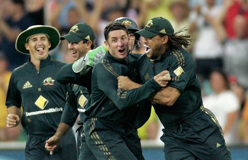 Bradd Hogg, Ricky Ponting, Mike Hussey and Andrew Symonds, from left, celebrate taking the wicket of Robin Uthappa during the first final of their tri-nations one-day international series at the Sydney Cricket Ground on Sunday, March 2, 2008. India are chasing 240 runs for victory. First final - India vs Australia