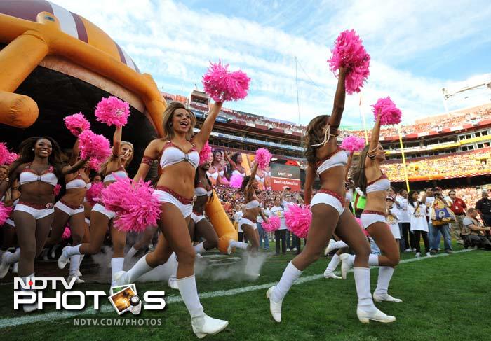 Cheerleaders for the Washington Redskins take the field before the game against the Minnesota Vikings on October 14.