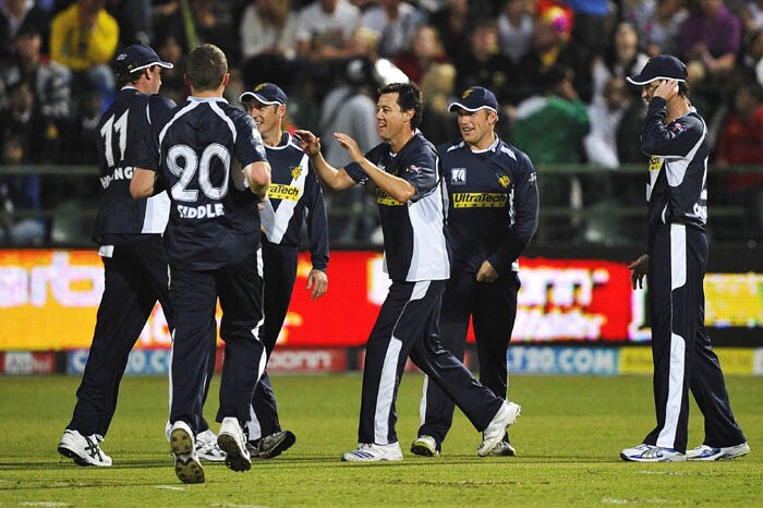 Bushrangers team celebrates the dismissal of Chennai's batsman Mike Hussey during the Champions League Twenty20 League match between Bushrangers and Chennai Super Kings at St. Georges park Stadium in Port Elizabeth. (AFP Photo) CLT20: Victoria vs Chennai