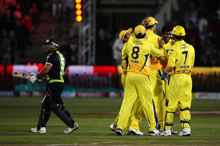 Chennai Super Kings team celebrates the dismissal of Warriors batsman Ashwell Prince during the Champions League Twenty20 League match between Warriors and Chennai Super Kings at St. Georges park Stadium in Port Elizabeth. (AFP Photo) CLT20: Chennai vs Warriors