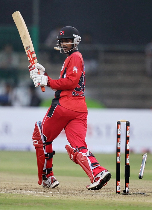 Trinidad and Tobago's Denesh Ramdin is bowled by a delivery during the Champions League T20 match against Somerset at Chinnaswamy Stadium in Bangalore on Monday. (PTI Photo) CLT20: T&T vs Somerset