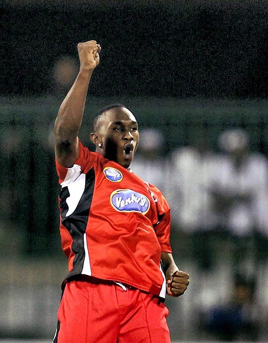 Trinidad and Tobago's Dwayne Bravo celebrates the wicket of Somerset's Craig Kieswetter during their Champions League T20 match at Chinnaswamy Stadium in Bangalore on Monday. (PTI Photo) CLT20: T&T vs Somerset