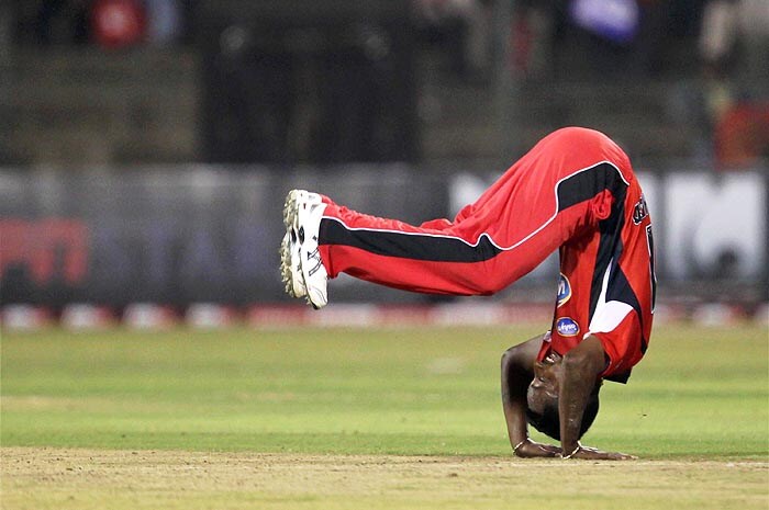 Trinidad and Tobago's D. Mohammad celebrates after taking the wicket of a Somerset batsman during their Champions League T20 match at Chinnaswamy Stadium in Bangalore on Monday. (PTI Photo) CLT20: T&T vs Somerset