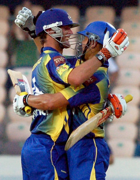 Cape Cobras' skipper Andrew Puttick celebrates his century during the Champions League Twenty20 match against Otago Volts in Hyderabad. (PTI Photo) CLT20: Cobras vs Volts