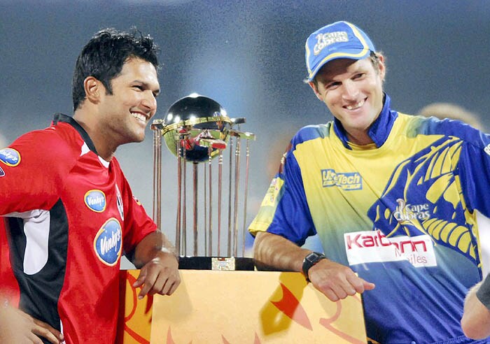 Captains - AG Puttick and D Ganga pose for a photograph with the Champions League Twenty20 Trophy before the start of Champions League Twenty20, 2nd semi-final at Rajiv Gandhi International Cricket Stadium, Hyderabad on Thursday. CLT20 2nd semis: T&T vs Cobras