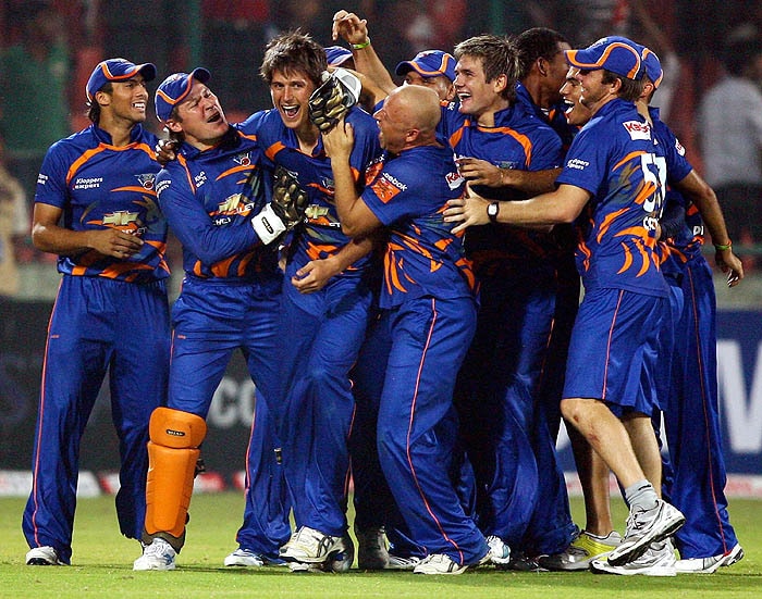 De Villiers (C) of Diamond Eagles celebrates with his teammates as they win over Sussex Sharks during the Super Over at the Champion's League match in New Delhi on Tuesday. (PTI Photo) CLT20: Eagles vs Sussex