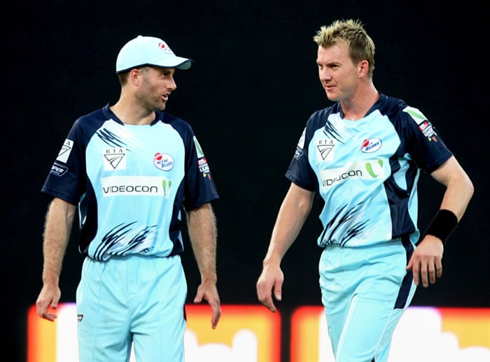 Fast bowler Brett Lee discusses match plan with NSW skipper Simon Katich during a Champions League T20 match against Diamond Eagles at Firoze Shah Kotla Stadium in New Delhi. (PTI Photo) CLT20: NSW vs Eagles