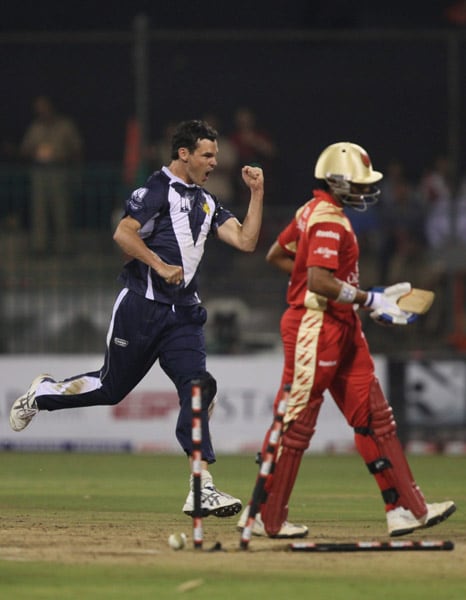 Bangalore Royal Challengers Robin Uthappa walks back to pavilion after being bowled by Clint McKay of Victoria Bushrangers at the Champions League T20 tournament in Chinnaswamy Stadium in Bangalore. (PTI Photo) CLT20: RCB vs Victoria