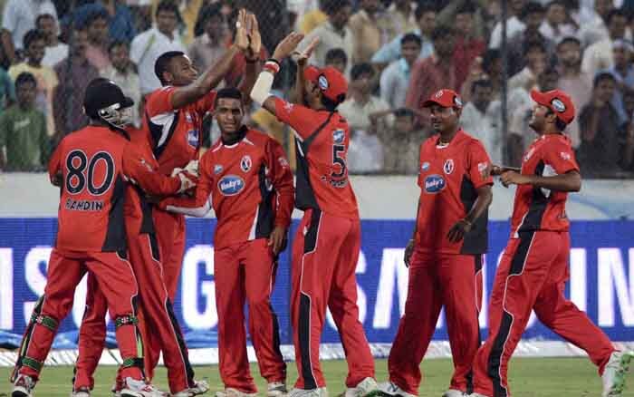 Trinidad & Tobago players celebrate the wicket of Captain of Deccan Chargers Adam Gilchrist during their Champions League T20 match at the Rajiv Gandhi International Stadium in Hyderabad on Wednesday. (PTI Photo) CLT20: DC vs TT