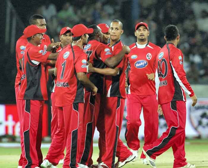 Trinidad & Tobago players celebrate the wicket of VVS Laxman of Deccan chargers during their Champions League T20 match in Hyderabad. (PTI Photo) CLT20: DC vs TT