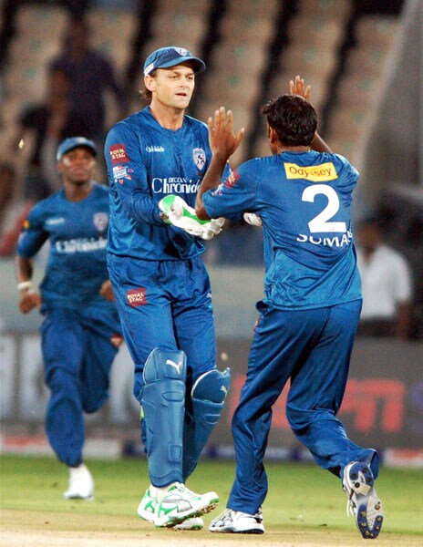 Deccan Chargers' TL Suman celebrates the wicket of Trinidad and Tobago's Dwayne Bravo during their Champions League T20 match in Hyderabad. (PTI Photo) CLT20: DC vs TT