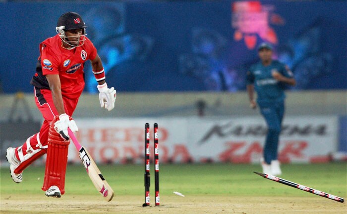 Trinidad and Tobago's Dwayne Bravo is run out during their Champions League T20 match against Deccan Chargers in Hyderabad. (PTI Photo) CLT20: DC vs TT
