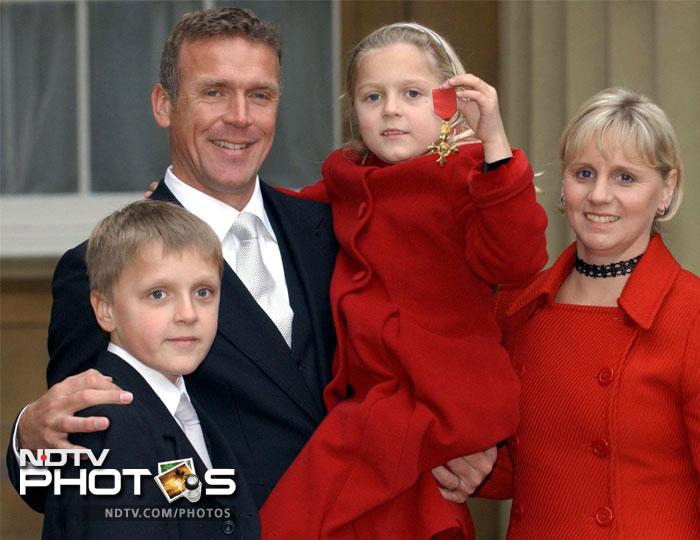 Surrey cricketer Alec Stewart stands with his wife Lynn and children Andrew, 10, and Emily, 7, in this photograph taken in 2003.