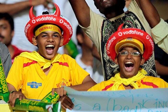 Fans of Chennai Super Kings cheer for their team during the IPL T20 match against Delhi Daredevils in Chennai on Thursday. (PTI Photo) IPL 3: Chennai vs Delhi