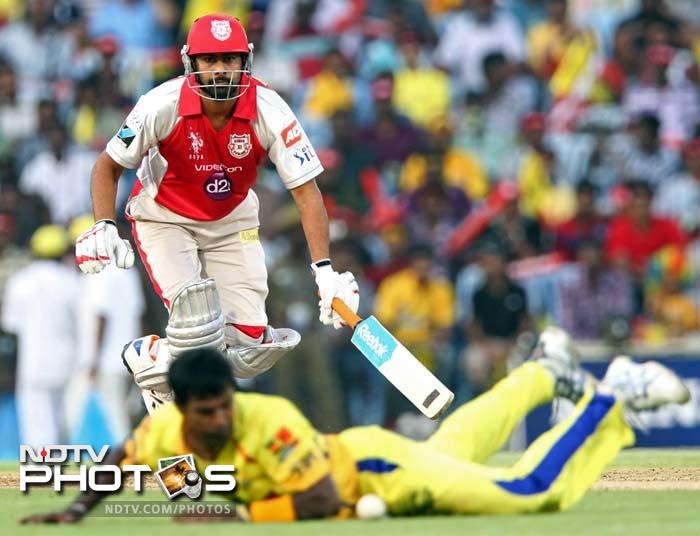 Sri Lanka and Chennai Super Kings' bowler Nuwan Kulasekara dives to stop a ball off his own bowling. (SESHADRI SUKUMAR / AFP) IPL 5: Punjab stun Chennai by 7 runs