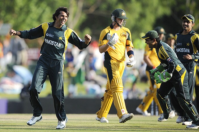 Pakistan's Mohammad Asif celebrates the dismissal of Australia's Cameron White during their Champions Trophy match against Pakistan at Centurion on Wednesday. (AFP Photo) CT: Aus vs Pak, Match 11