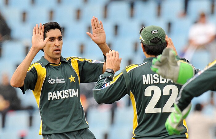Pakistan's Umar Gul celebrates with teammates after his dismissal of Australia's Shane Watson during their Champions Trophy match at SuperSport Park in Centurion on Wednesday. (AFP Photo) CT: Aus vs Pak, Match 11
