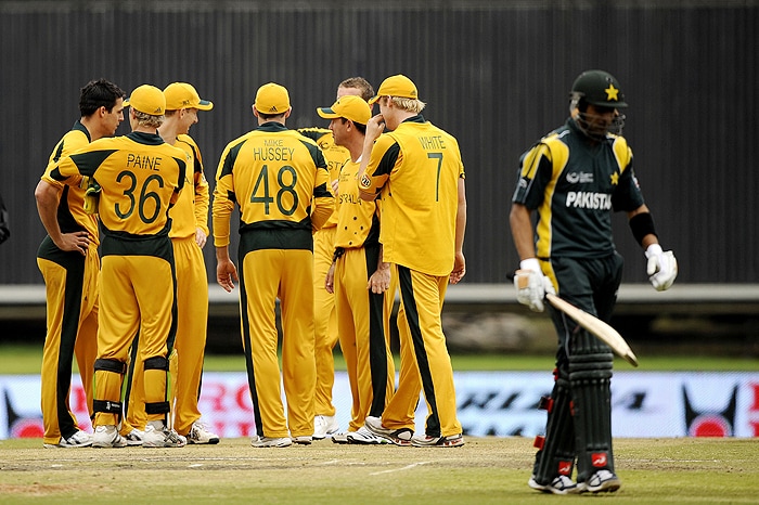 Australian team members celebrate the dismissal of Pakistan's Shoaib Malik during their Champions Trophy match against Australia on Wednesday at SuperSport Park in Centurion. (AFP Photo) CT: Aus vs Pak, Match 11