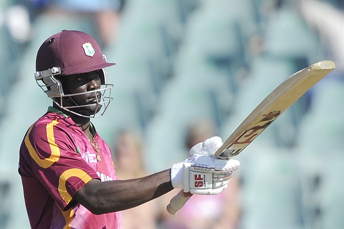 West Indies' Andre Fletcher raises his bat as he celebrates 50 runs during their Champions Trophy match against Australia at The New Wanderers Stadium in Johannesburg on Saturday. (AFP Photo) CT: WI vs Aus, Match 5