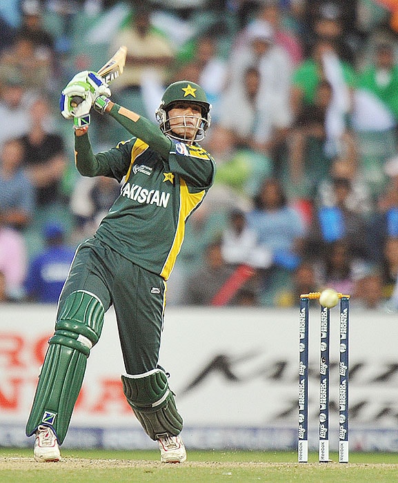 Pakistan's batsman Saeed Ajmal plays a shot off the ball of New Zealand's Shane Bond during their ICC Champions Trophy 2nd semi-final match at The New Wanderers Stadium in Johannesburg on Saturday. (AFP Photo) CT semis: Pak vs NZ, Match 14