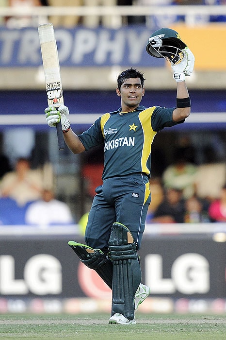 Pakistan's Umar Akmal raises his bat as he celebrates scoring 50 runs during the ICC Champions Trophy semi final match against New Zealand at The New Wanderers Stadium in Johannesburg on Saturday. (AFP Photo) CT semis: Pak vs NZ, Match 14