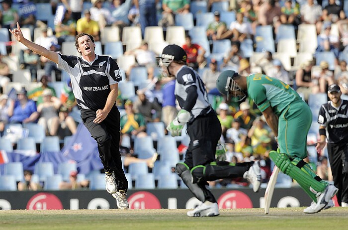 New Zealand's Kyle Mills celebrates the dismissal of South African batsman JP Duminy during their ICC Champions Trophy group match at Supersport Park in Centurion on Thursday. (AFP Photo) CT: SA vs NZ, Match 3