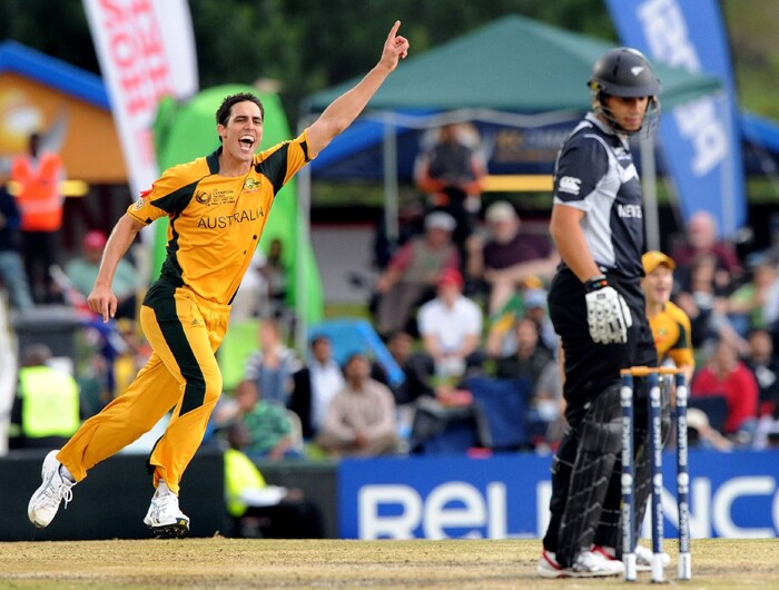Australia's Mitchell Johnson celebrates the wicket of New Zealand's Ross Taylor during the ICC Champions Trophy's final match in Centurion. (AFP Photo) CT: Aus vs NZ, Final