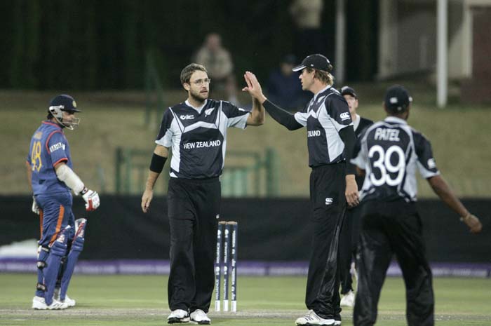 New Zealand players celebrate after Indian captain Mahendra Singh Dhoni was caught out while Indian player Suresh Raina looks on during a warm up match between India and New Zealand ahead of the Champions Trophy at Potchefstroom. (AP Photo) CT: Ind vs NZ warm-up tie