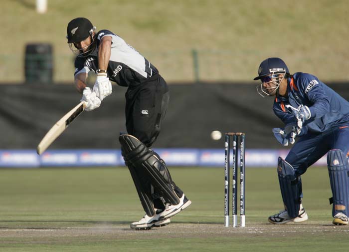 New Zealand's Niel Broom hit the ball with Indian wicket keeper Mahendra Singh Dhoni during a warm up match between India and New Zealand ahead of the Champions Trophy at Potchefstroom. (AP Photo) CT: Ind vs NZ warm-up tie