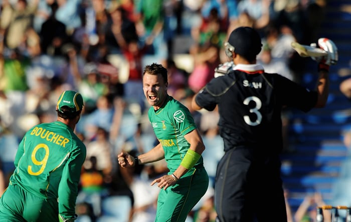 Johan Botha celebrates with teammates Mark Boucher the dismissal of Owais Shah for 98 runs during the ICC Champions Trophy match between England and South Africa in Centurion. (AFP Photo) CT: Eng vs SA, Match 8