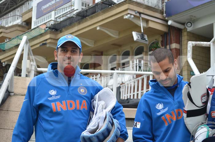 Dhoni and Dhawan on the way for a session at the nets. ICC Champions Trophy: Team India gear up for clash against West Indies