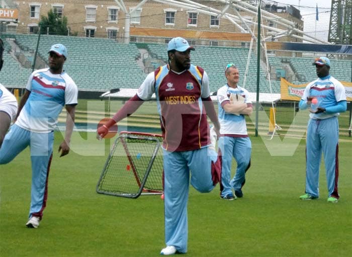 Chris Gayle has a stretch in the nets as he gears up for the clash against India. ICC Champions Trophy: Team India gear up for clash against West Indies