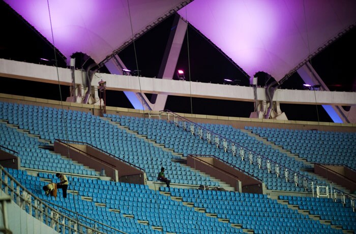 Inside the Jawaharlal Nehru stadium, workers put finishing touches. The stadium can seat 60,000. (AFP Photo)