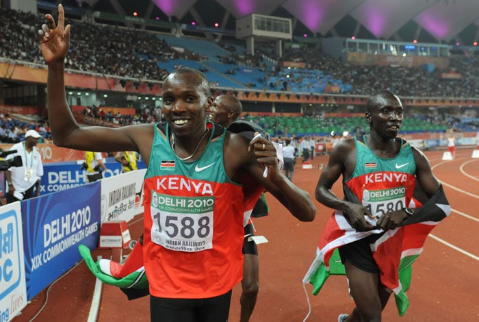 Kenya's Boaz Lalang celebrates with Richard Kipagat after the men's 800m final of Track and Field competition of the XIX Commonwealth Games in New Delhi. Kenya's Boaz Lalang crossed the line in 1:46.60 to win the men's 800m gold medal at the Commonwealth Games and lead a Kenyan clean sweep, his teammate Richard Kipagat took the silver (1:46.95) and Abraham Kiplangat (1:47.37) claimed the bronze. (AFP Photo)