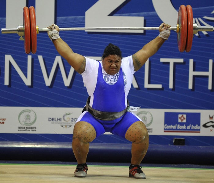 Ele Opeloge of Samoa attempts a lift in the 75+ kg women's snatch weightlifting event at the Jawaharlal Nehru Sports Complex during the Commonwealth Games in New Delhi. (AFP Photo)