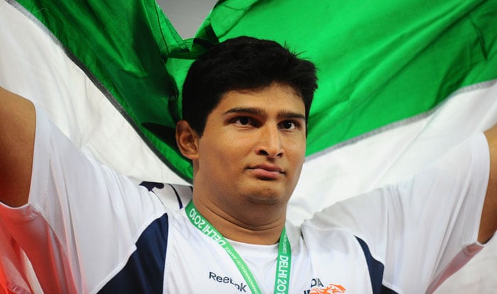 India's Vikas Gowda celebrates after the men's discus throw final of Track and Field competition of the XIX Commonwealth Games in New Delhi. Australia's Benn Harradine won the men's discus gold medal at the Commonwealth Games on Sunday with a throw of 65.45 metres. India's Vikas Gowda (63.69) took the silver and England's Carl Myerscough (60.64) claimed the bronze. (AFP Photo)