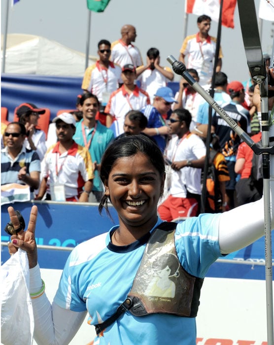 India's gold medalist Deepika Kumari celebrates winning the Archery Women's Individual of the XIX Commonwealth Games in New Delhi. (AFP Photo)
