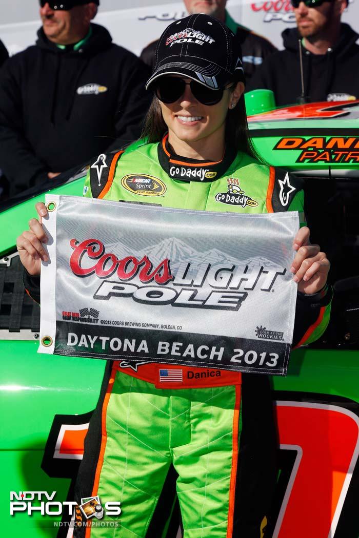 After a successful qualifying, a joyous Danica poses with the Coors Light Pole Award after qualifying for the NASCAR Sprint Cup Series Daytona 500 on February 17, 2013.