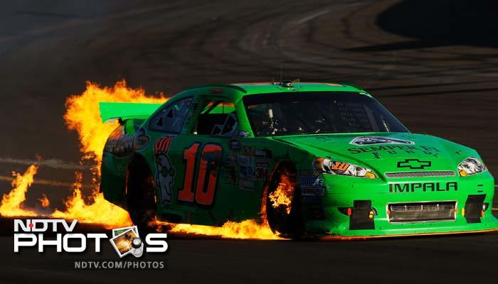 Danica drives the wrecked Chevrolet as flames shoot from the back of her car after an incident in the NASCAR Sprint Cup Series last November.