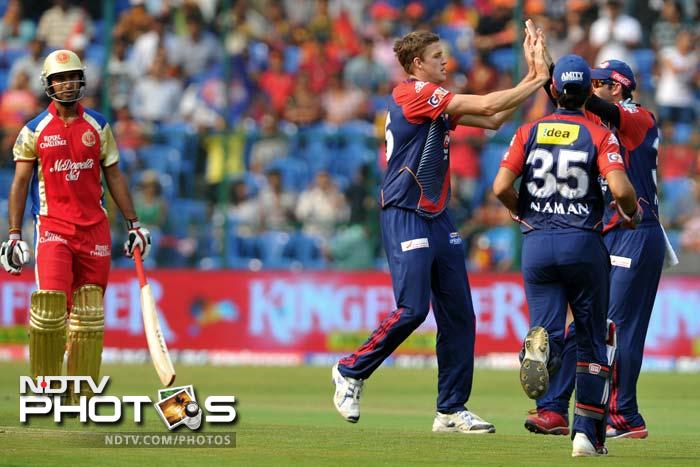 Delhi won the toss and opted to field first. Chris Gayle was missing for Bangalore and Morne Morkel was in ripe form. He removed Cheteshwar Pujara early. (AFP PHOTO/Manjunath KIRAN) IPL 5: Bangalore ease past Delhi