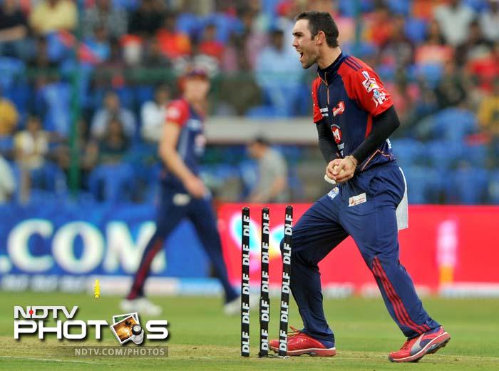 The likes of Daniel Vettori and Saurabh Tiwary were dismissed (Glenn Maxwell is seen here celebrating the dismissal of Vettori) but de Villiers managed to keep his calm. (AFP PHOTO/Manjunath KIRAN) IPL 5: Bangalore ease past Delhi